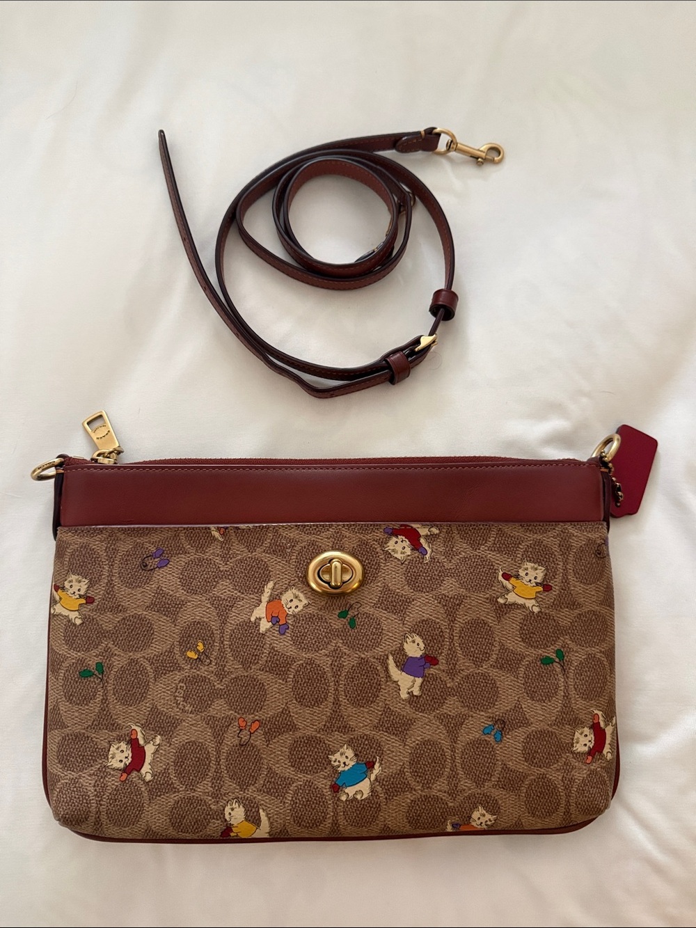 Coach Signature Canvas Crossbody with Red Leather Trim and Multicolor Print